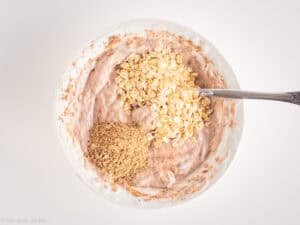 Oats and seeds added to the chocolate banana mixture.