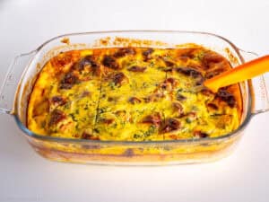 Sliced casserole in a glass dish.