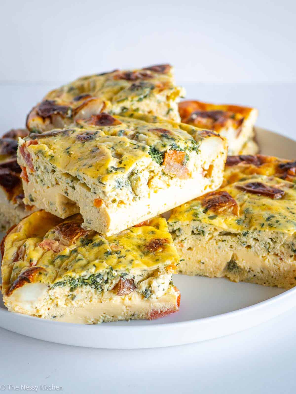 Slices of breakfast casserole on a serving plate.