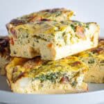 Egg breakfast casserole servings on a plate.