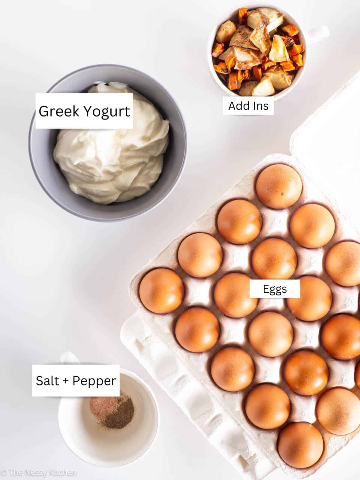 Eggs, yogurt and vegetables measured out into bowls.