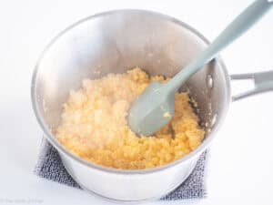 Eggs cooking in a pot.