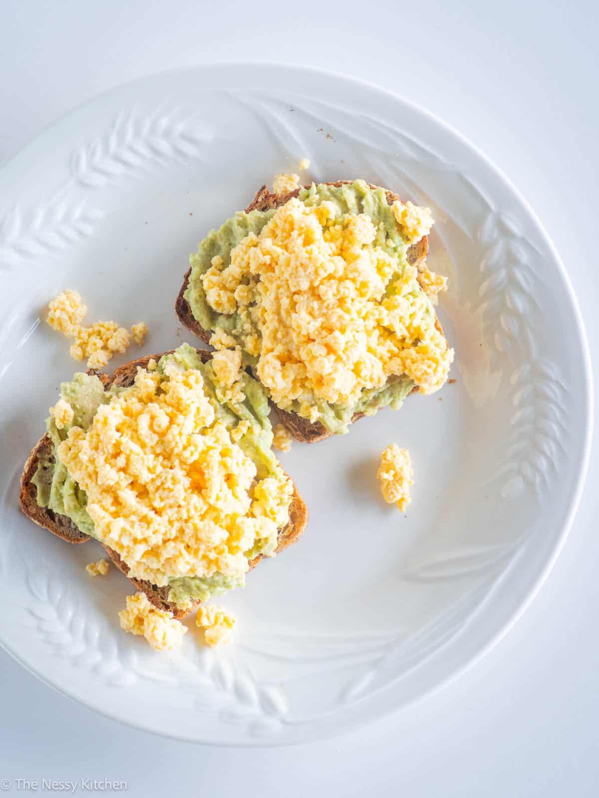 Scrambled eggs and avocado on toast.