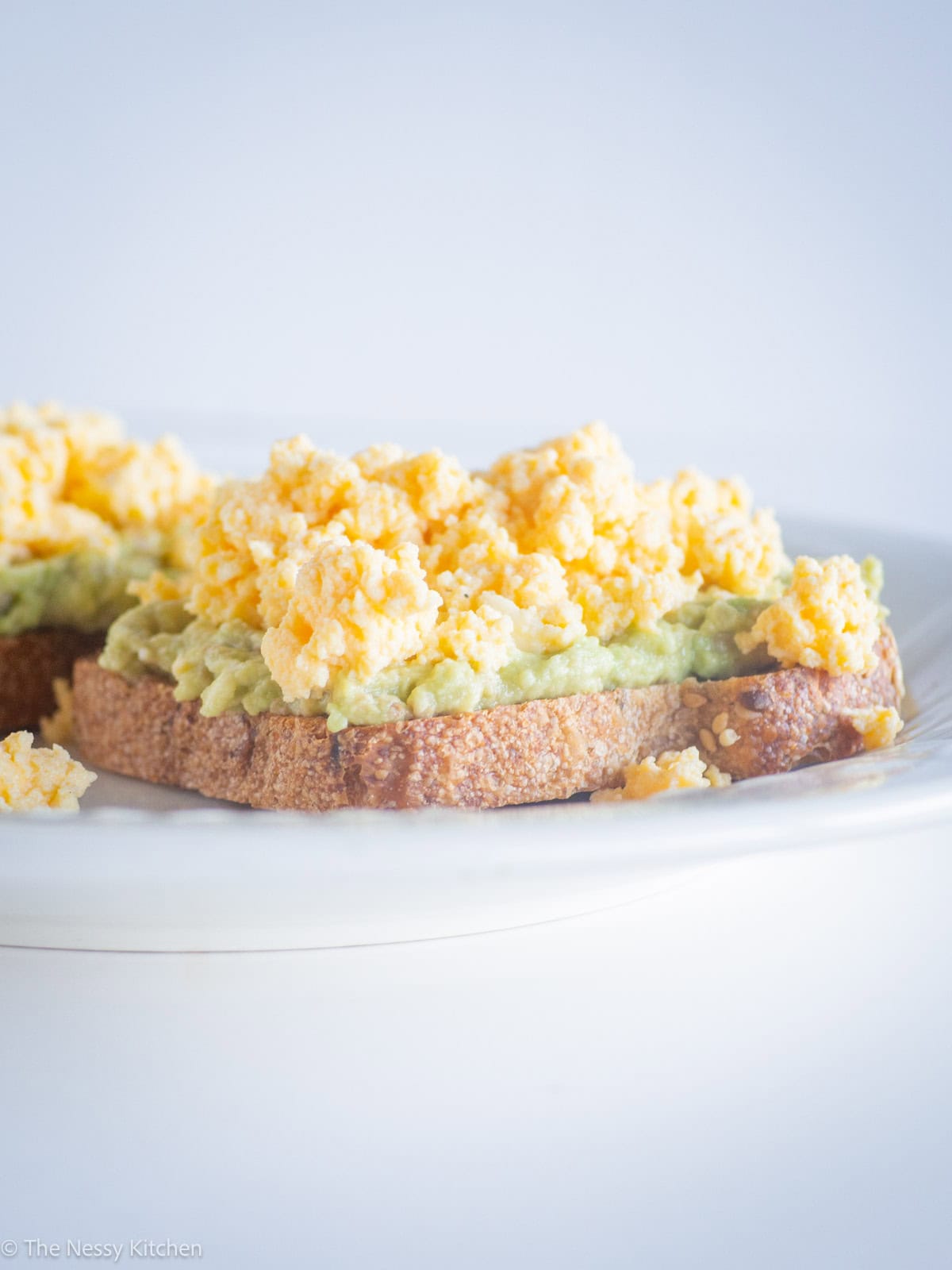 Eggs and avocado on toasted bread.