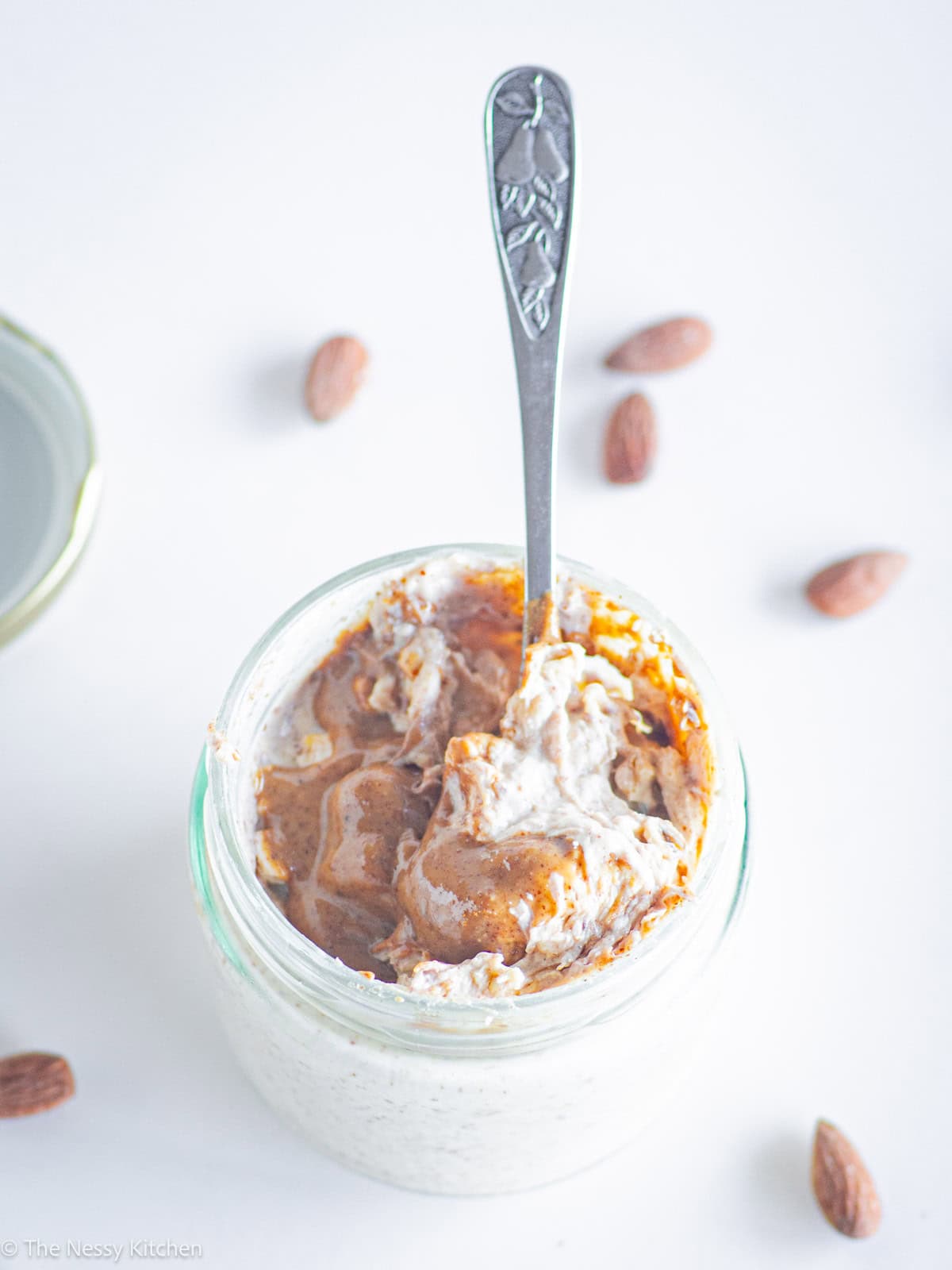 Spoon taking a scoop from a jar.