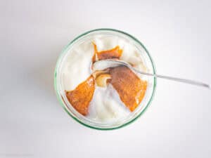 Almond butter and yogurt in a jar.