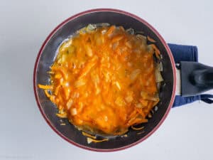 Eggs poured over vegetables.