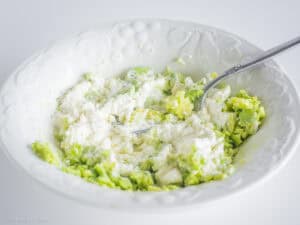 Avocado mashed up with cottage cheese.