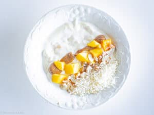 Toppings placed on a yogurt bowl.