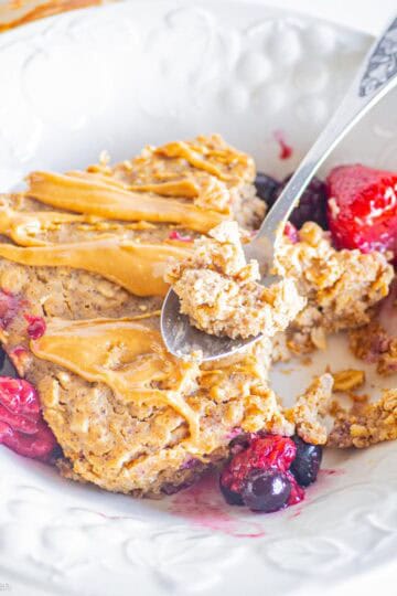 Spoon taking a scoop of baked oatmeal.