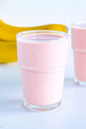 Pink smoothie in a glass.