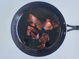Cooked bacon in a pan.