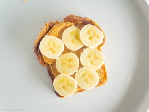 Bananas on toast on plate.