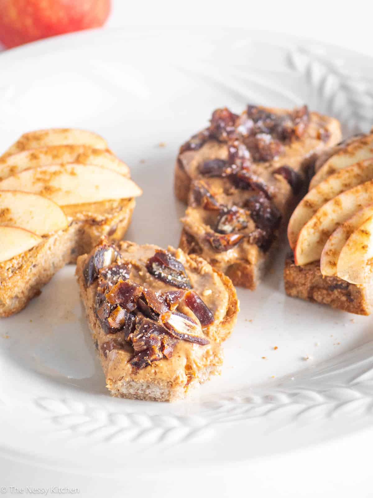Slices of almond butter toast on plate.
