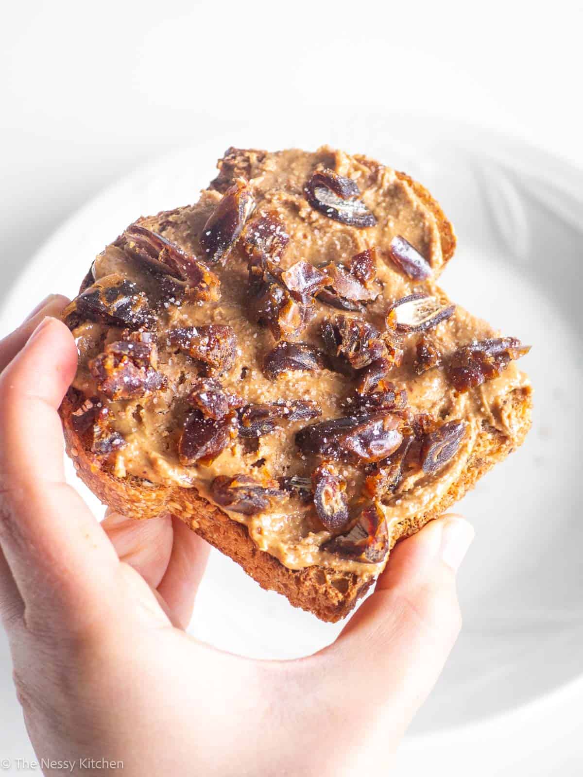 Almond butter toast in hand.