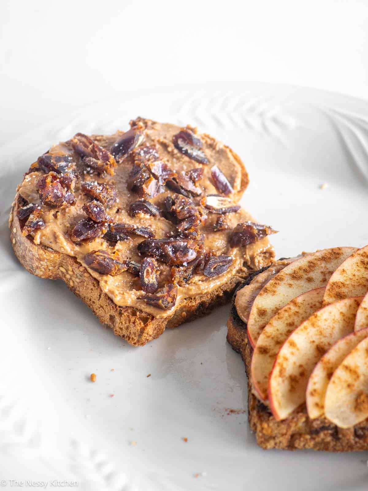 Almond butter toasts on plate.