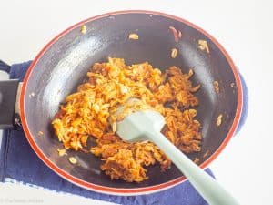 Oats and cinnamon added to pan with butter and apples.