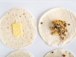 Burrito filling laid out in tortilla.
