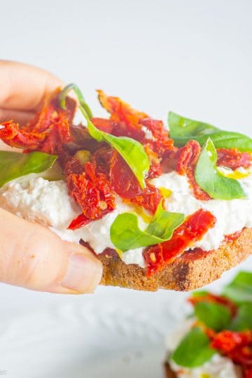 Cottage cheese pizza toast in hand.