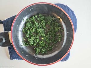 Spinach and butter in pan.