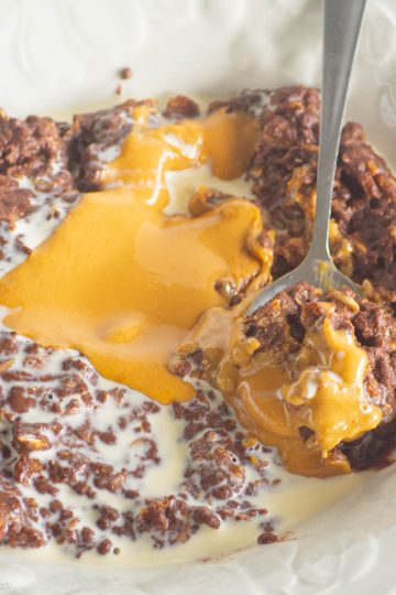 Peanut butter cup oatmeal in bowl with spoon.