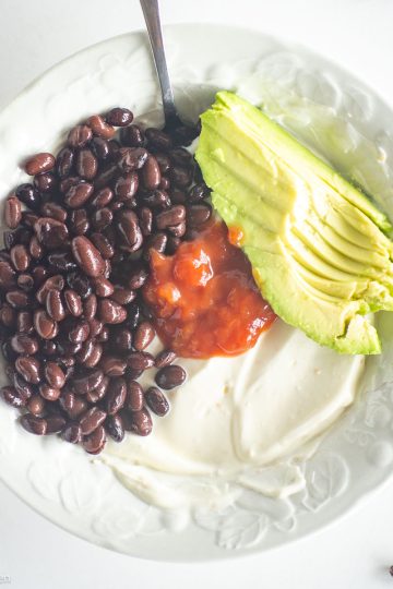 Southwest yogurt bowl on counter with spoon.