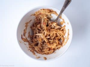 Shredded apple mixed with cinnamon.