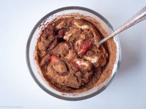 Strawberries mixed with yogurt and cocoa.