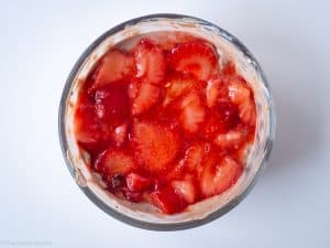 Strawberries arranged over oats.