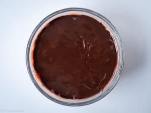 Chocolate poured over strawberry mixture.