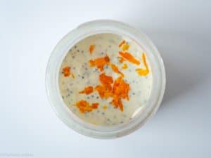 Oatmeal mixed together and topped with orange zest.