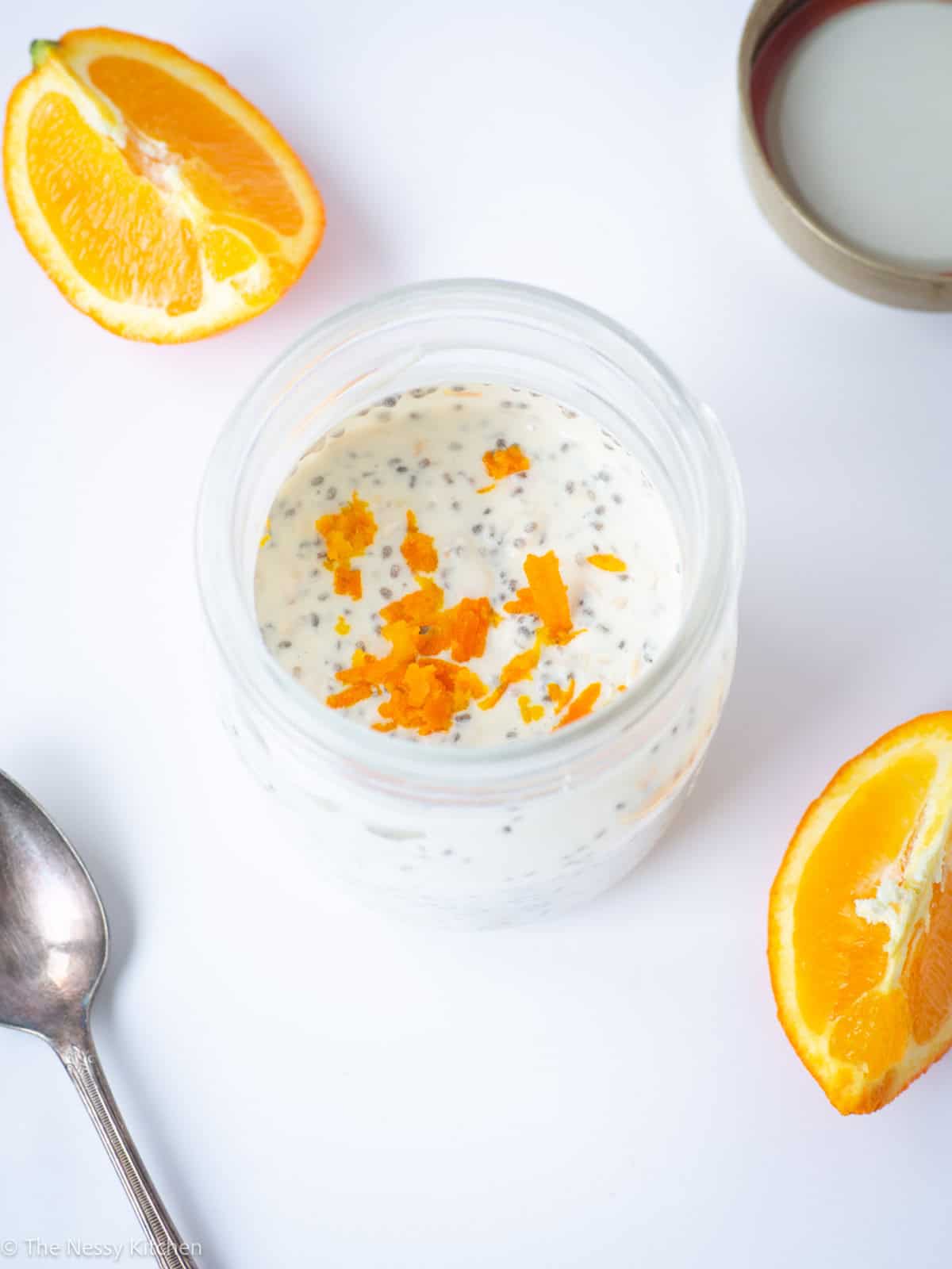 Overnight oatmeal in a jar with a spoon.