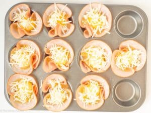 Cheese sprinkled on top of eggs.