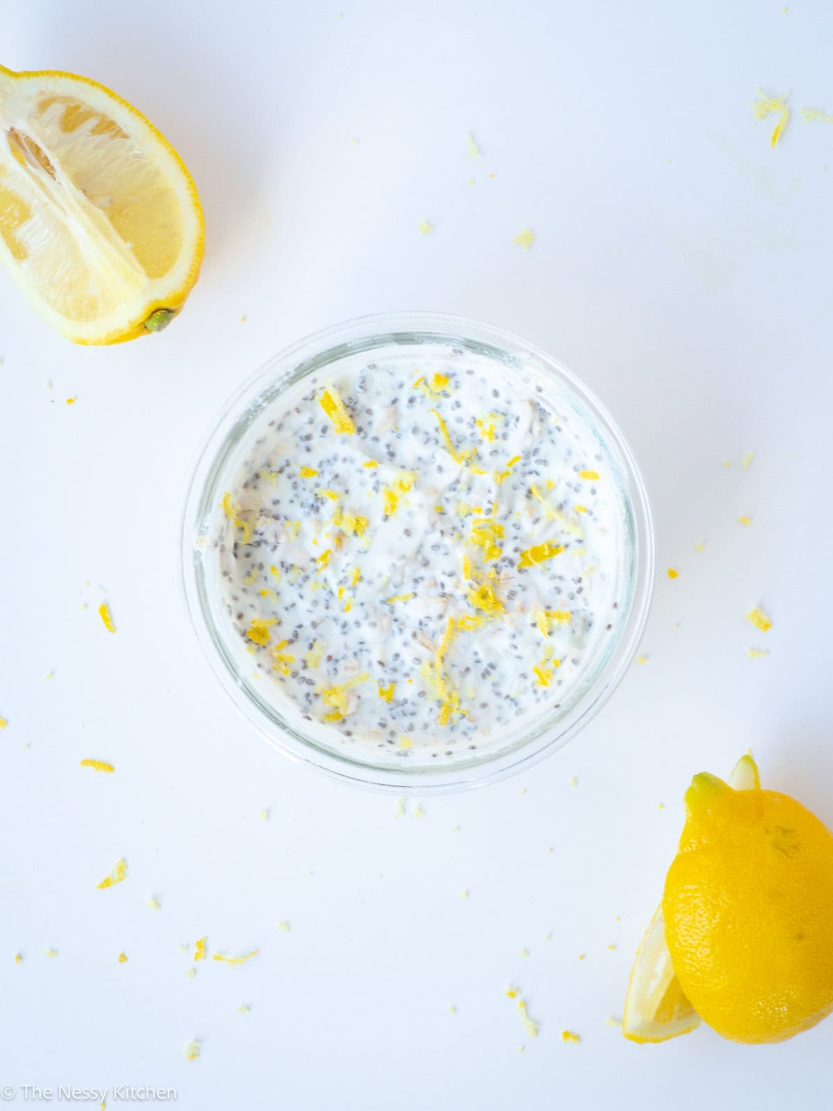 Oats and yogurt in a bowl with lemon zest.