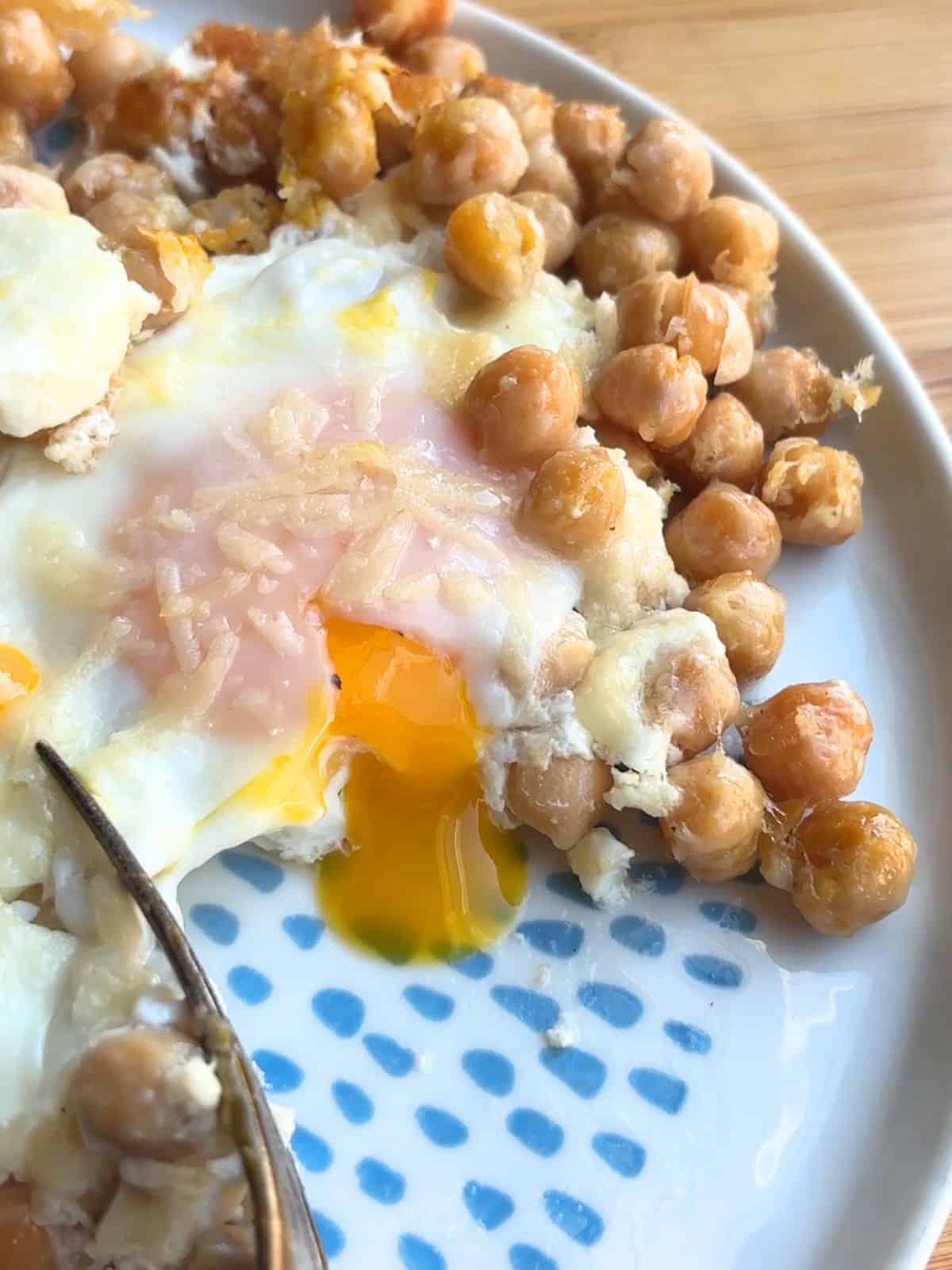 Yolk running out of a fried egg.