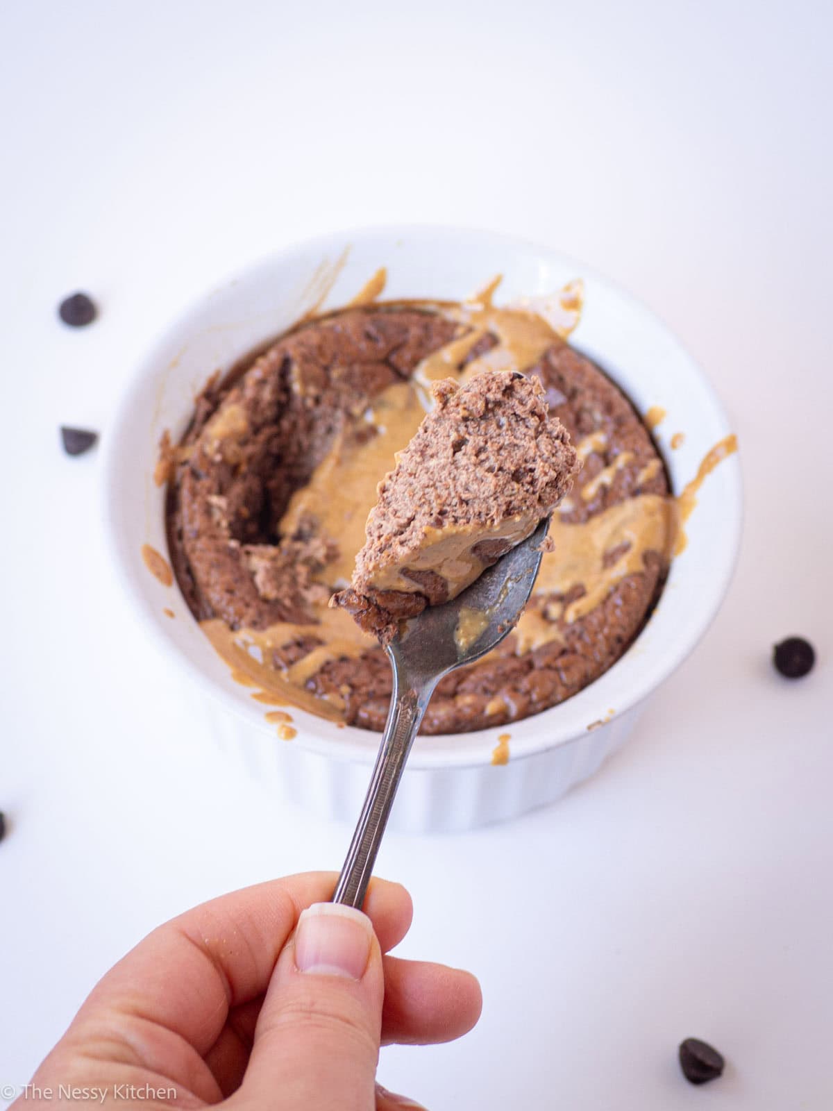 Spoonful of baked yogurt with peanut butter.