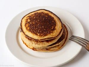 Pancakes stacked on a plate.