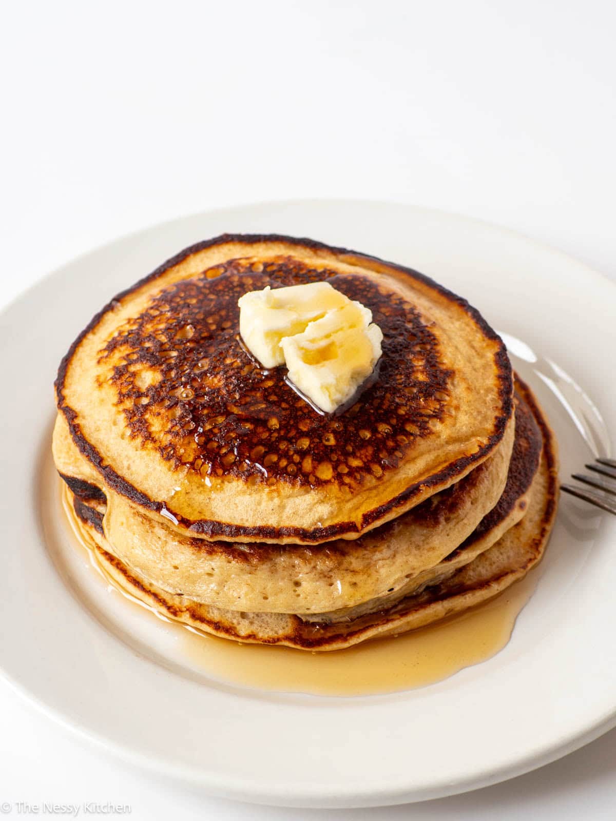 Stack of pancakes on a plate.