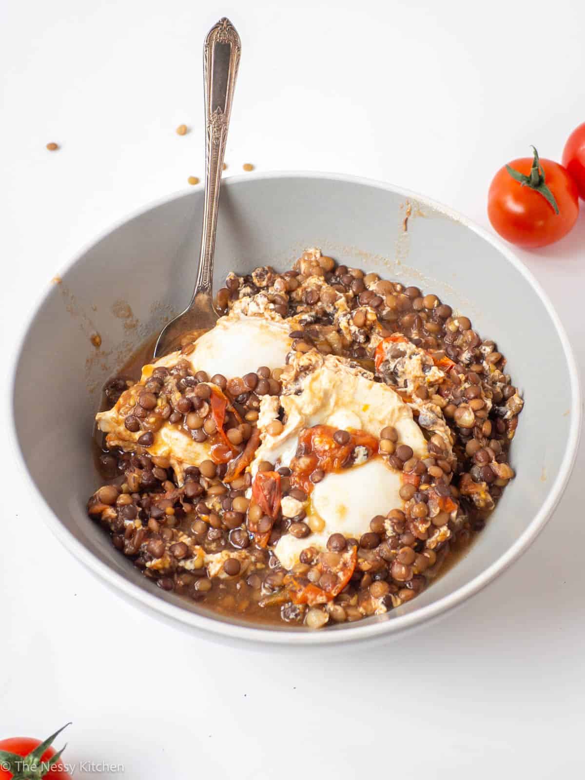 Breakfast in a bowl with a spoon.