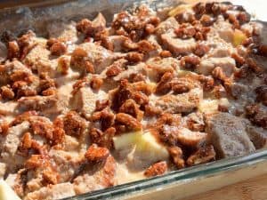 Assembled apple French toast casserole in a dish prior to baking.