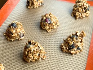 Cookie dough portioned out a on baking tray.
