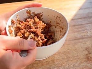 Pecans mixed with maple syrup.